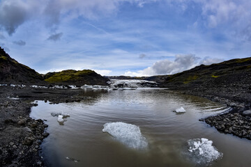 Fototapeta na wymiar Beautiful Iceland landscape: Lagoon with blocks of ice on sunny day, Iceland nature. Ice lagoon in Iceland