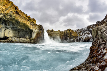 Naklejka na ściany i meble Beautiful waterfall in Iceland. Typical Iceland landscape, wild nature