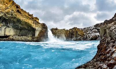 Fototapeta na wymiar Beautiful waterfall in Iceland. Typical Iceland landscape, wild nature