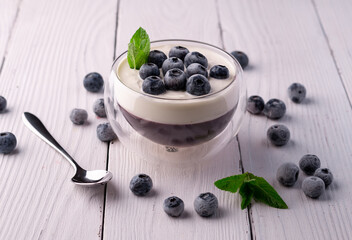 dessert in a glass bowl with blueberries