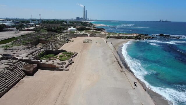 Caesarea Beach and archaeological site with electric chimneys, Aerial
Drone view over Mediterranean sea and  Caesarea Beach archaeological, site

