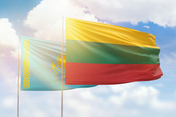 Sunny blue sky and flags of lithuania and kazakhstan
