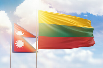 Sunny blue sky and flags of lithuania and nepal