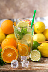 glas with lemonade or mojito cocktail with lemon and mint, cold refreshing drink or beverage with ice