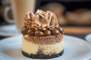 an individual cake with cream and chocolate