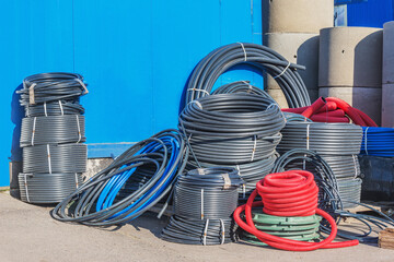 Plastic pipes by the construction shop.