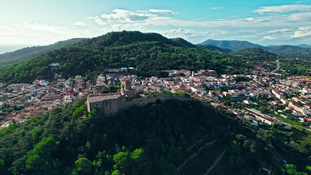 Castell de Capdepera - remains of an ancient stone Spanish castle on Majorca. Panoramic view from above of Capdepera municipality with old traditional houses on Mallorca, Balearic Islands, Spain.