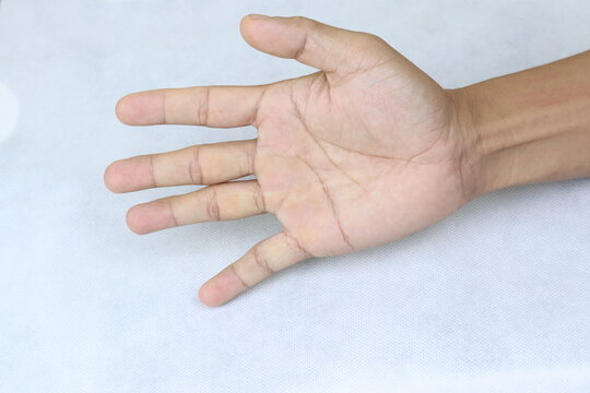 Asian Hand Concept That Is Forming A Game Of Rock Paper Scissors Isolated With White Backgorund