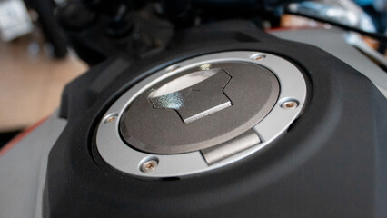 Motorcycle parts: engine, gears, wheels and chain.