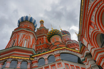 Fototapeta na wymiar Domes of St. Basil's Cathedral against blue sky on a cloudy day morning, at Kremlin sqaure, Moscow