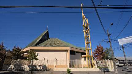 View of a street and modern church in a small south american town (Talca, Chile)