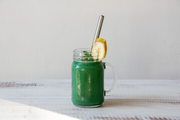 smoothie mug with spirulina and banana