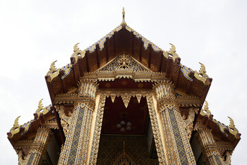 Fototapeta na wymiar Bangkok, Thailand, february, 16, 2022: upper part of the entrance of a buddhist temple