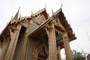 Fototapeta na wymiar Bangkok, Thailand, february, 16, 2022: Upper part of the entrance of a Buddhist temple