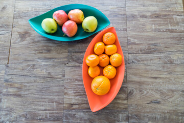 Organic Apples oranges and mandarins in trays