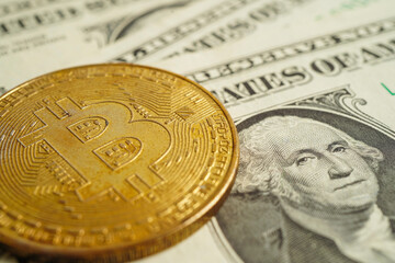 Golden bitcoin on US dollar banknotes money for business and commercial, Digital currency, Virtual cryptocurrency, blockchain technology.