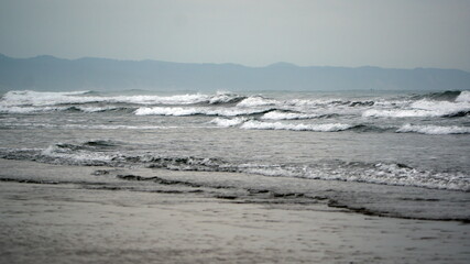 Waves breaking on the beach in Canoa, Ecuador