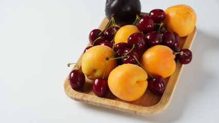 A Berry mix apricot, plum, cherry. Fresh fruits. Vegetarian healthy detox food.