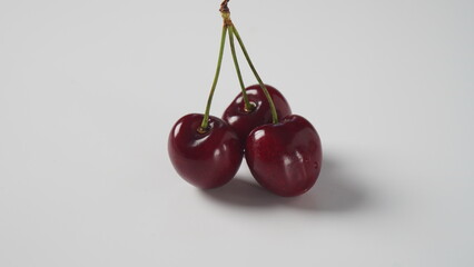 Sweet red cherries on a plate, fresh ripe sour cherries.