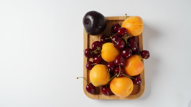 A Berry mix apricot, plum, cherry. Fresh fruits. Vegetarian healthy detox food.