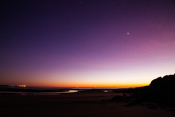 Purple dawn, early morning at low tide