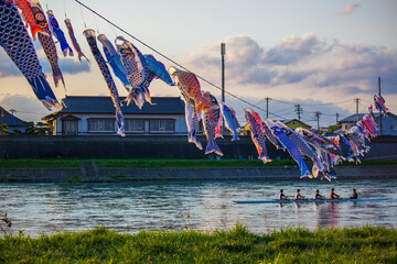 Kitakami,Iwate,Tohoku,Japan on April 26,2018:Carp streamers (or koinobori) and rowing boat at...