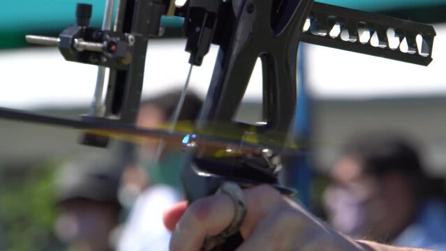 Arrow release in slow motion from the front