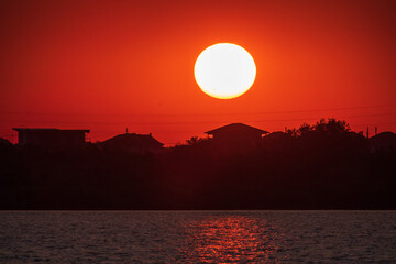 The sun goes down over a lake