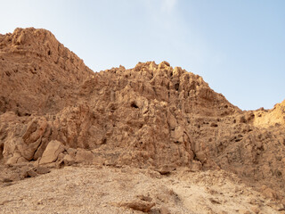 Fototapeta na wymiar Stone desert near the Rahaf stream, on the Israeli side of the Dead Sea, near Jerusalem in Israel