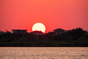 The sun goes down over a lake