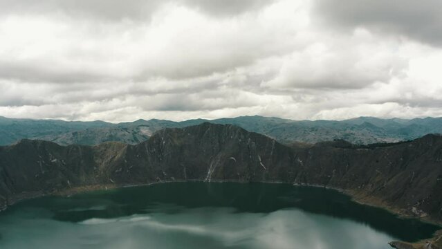 Drone Flyover Hikers On Top Of Quilotoa Loop Overlooking The Lagoon In Ecuador. Aerial Shot