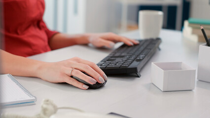 Sales consultant planning business charts statistics on computer, working with e commerce reports. Executive assistant analyzing data research diagrams. Handheld shot. Close up.
