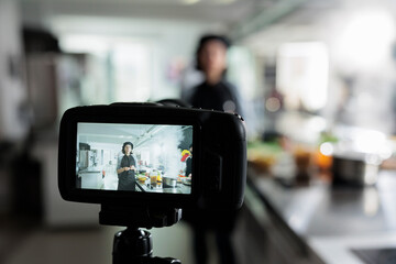 Close up of camera recording head cook presenting herbs and ingredients for dish while doing a cooking course. Culinary content creator preparing gourmet food for internet culinary vlog.
