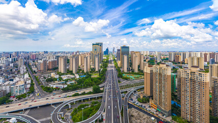 Fototapeta na wymiar Haikou Cityscape with Landmark Buildings and Urban Overpass during Sunny Daytime, Hainan Province, the Largest Free Trade Zone in China.