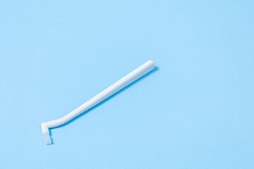 orthodontic toothbrush with one bundle for braces on a blue background special tool for oral care