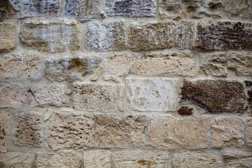 Texture of an ancient old stone wall.
