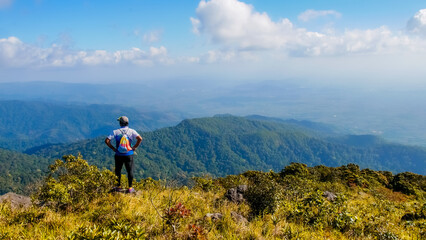 Tourists looking at the beautiful scenery on the high mountains in Thailand. trekking tourism concept