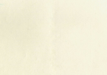 Large image paper texture background with aged uncoated fine fiber grain and dust particles sketch water color paper in light beige yellowed color smooth with copy space for text wallpapers or designs