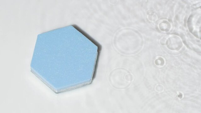 Blue podium top view, rain drops on water surface on grey, product design mockup
