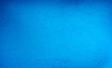 Fondo de degradado azul de pared con textura.