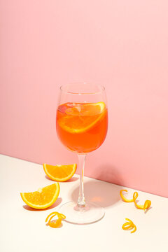 Concept of fresh alcohol drink, Aperol Spritz on two tone background