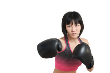 Young asian woman wearing boxing gloves punching, isolated on white background.