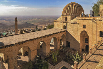 Dome of Zinciriye Medrese with mesopotamian valley in background, Mardin, south east Turkey