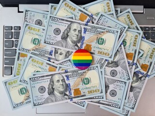 LGBT pride flag for gay community money on keyboard