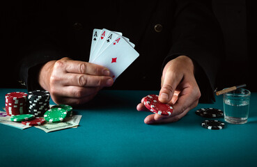 Playing cards with a winning combination in poker four of a kind or quads in the hand of a lucky...