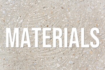 MATERIALS - word on concrete background. Cement floor, wall.