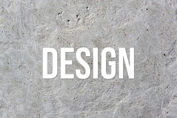 DESIGN - word on concrete background. Cement floor, wall.