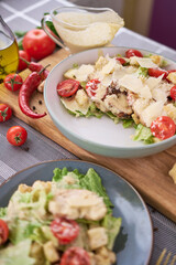 Healthy Grilled Chicken Caesar Salad with Cheese, tomatoes and Croutons