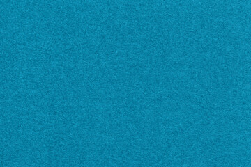 Texture of light blue and turquoise colors paper background, macro. Structure of dense craft...