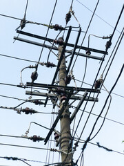 Electricity pole and power line under the blue sky